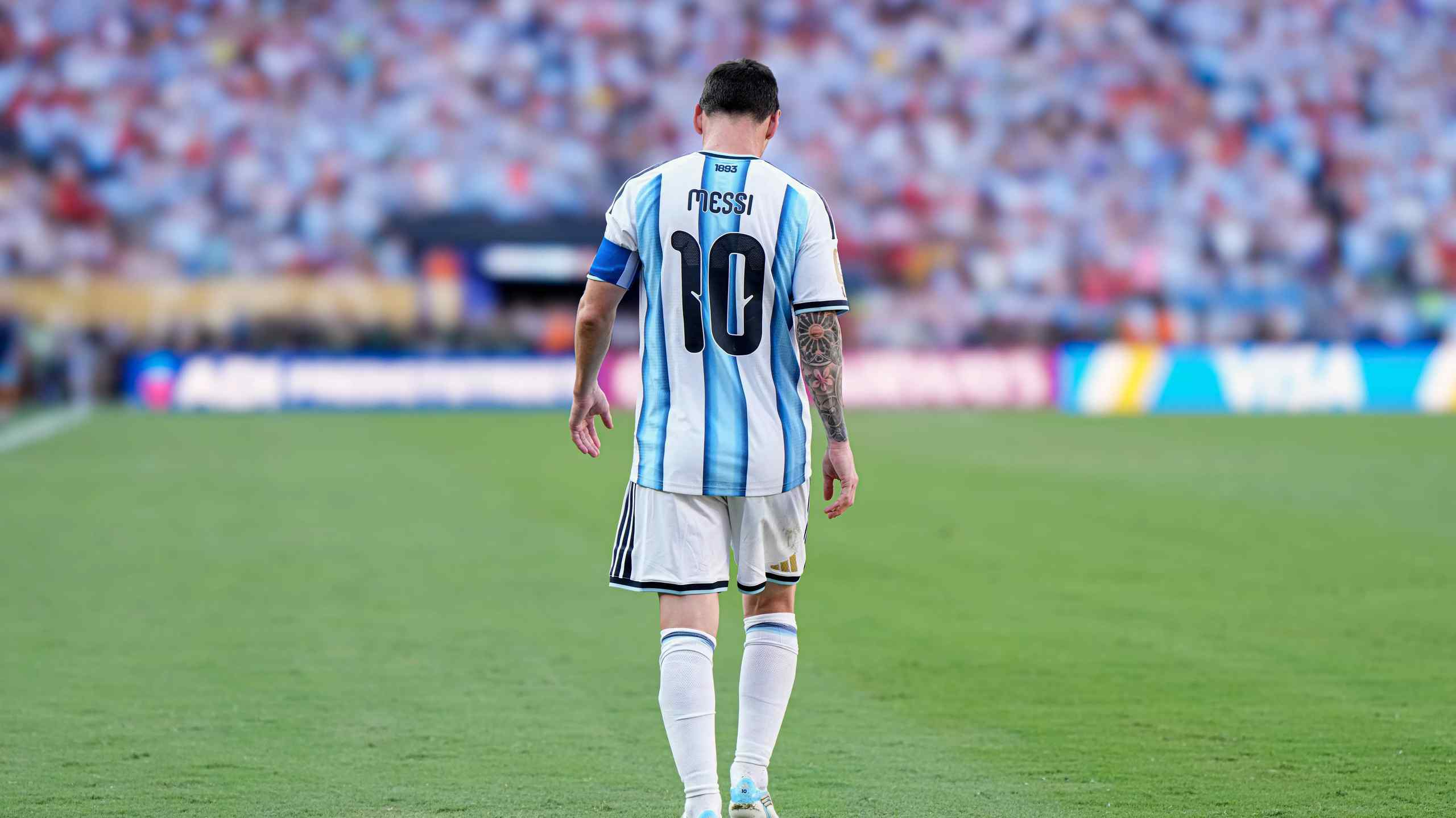 Lionel Messi walks off the pitch.